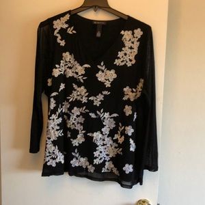 Black blouse with white embroidered flowers